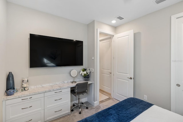 bedroom with light carpet