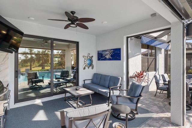 view of patio with ceiling fan and outdoor lounge area