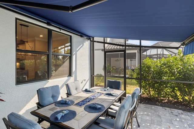 view of patio with a lanai