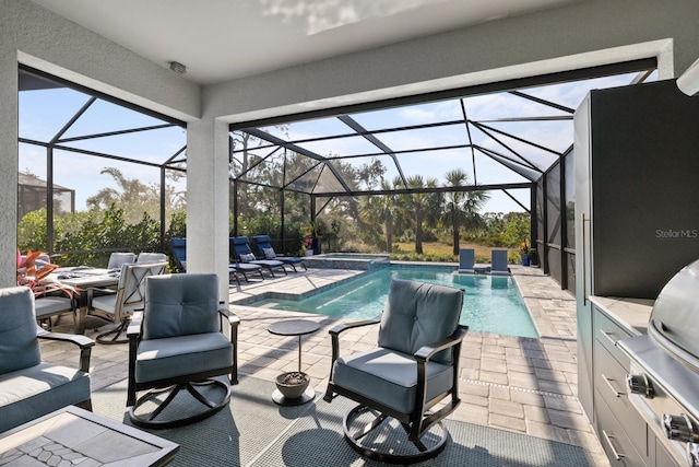 view of patio featuring a pool with hot tub, glass enclosure, and an outdoor kitchen