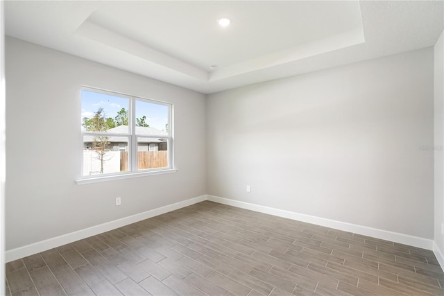 empty room with a tray ceiling