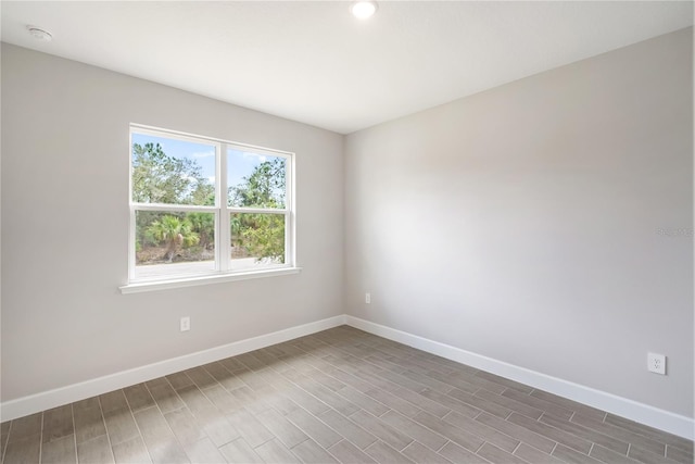 spare room featuring dark hardwood / wood-style flooring