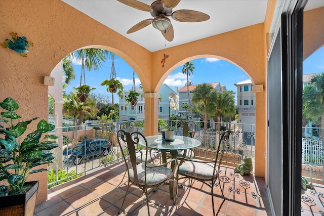 view of patio / terrace featuring ceiling fan and a balcony