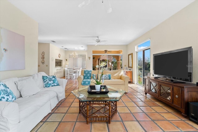 tiled living room with ceiling fan