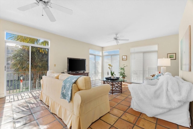 tiled living room with ceiling fan