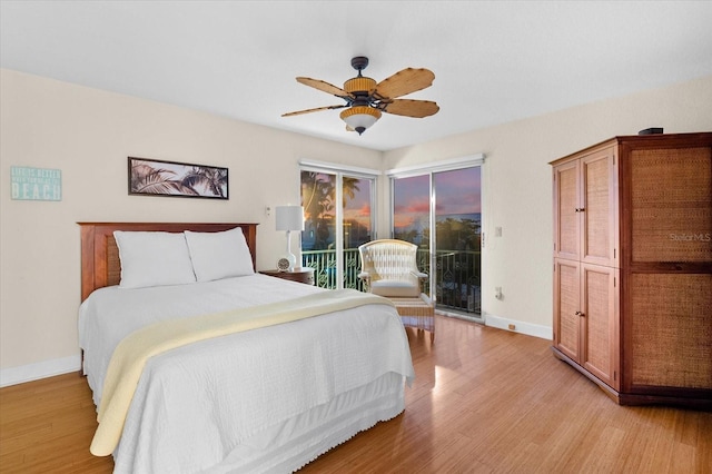 bedroom featuring access to exterior, ceiling fan, and light wood-type flooring