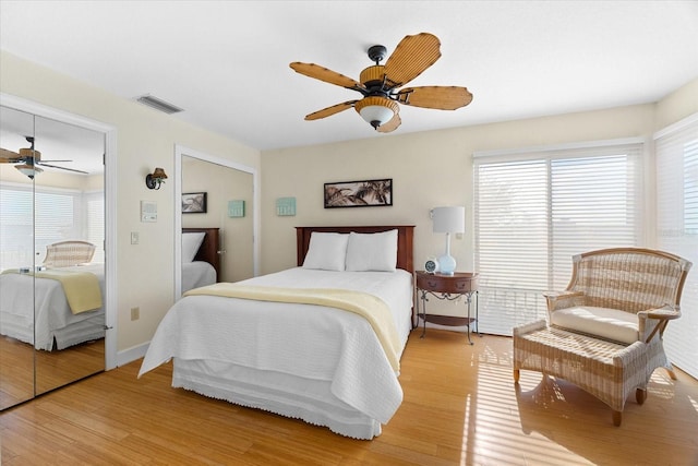 bedroom with light wood-type flooring and ceiling fan