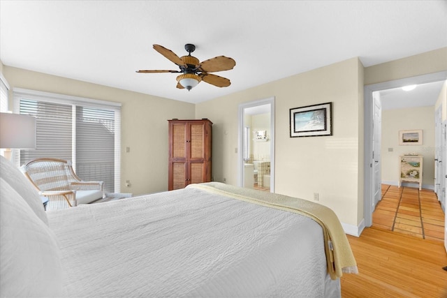 bedroom featuring wood-type flooring, connected bathroom, and ceiling fan