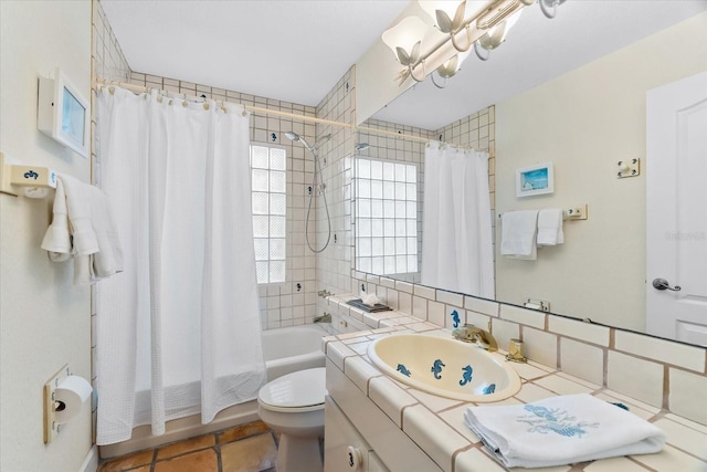 full bathroom with shower / tub combo, tile patterned flooring, an inviting chandelier, vanity, and toilet