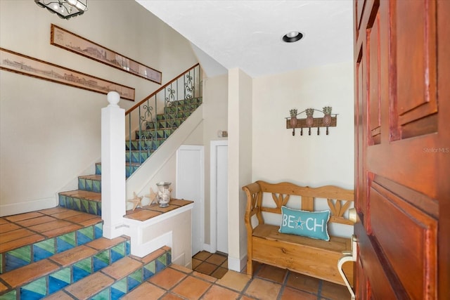 foyer entrance with tile patterned floors