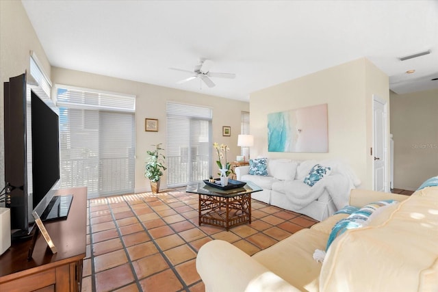 tiled living room featuring ceiling fan