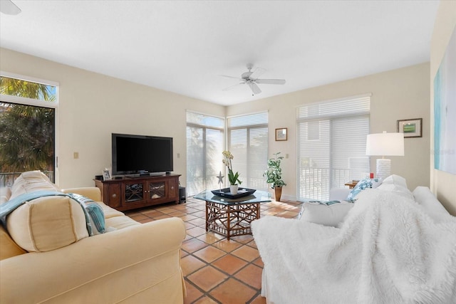 living room with light tile patterned floors and ceiling fan