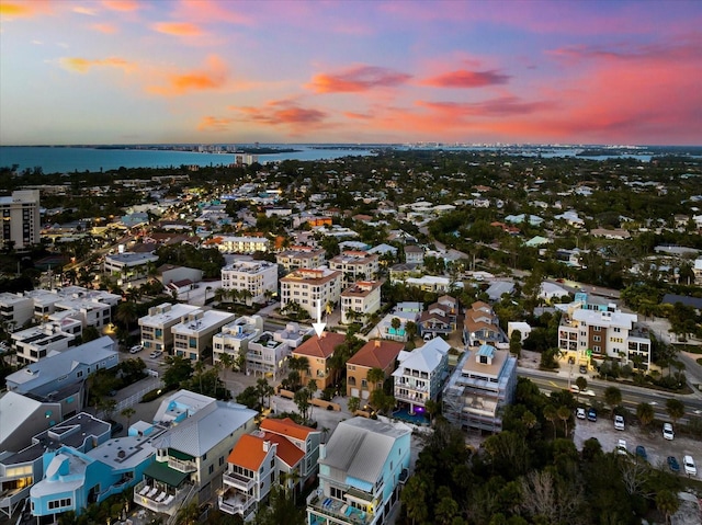 aerial view at dusk with a water view