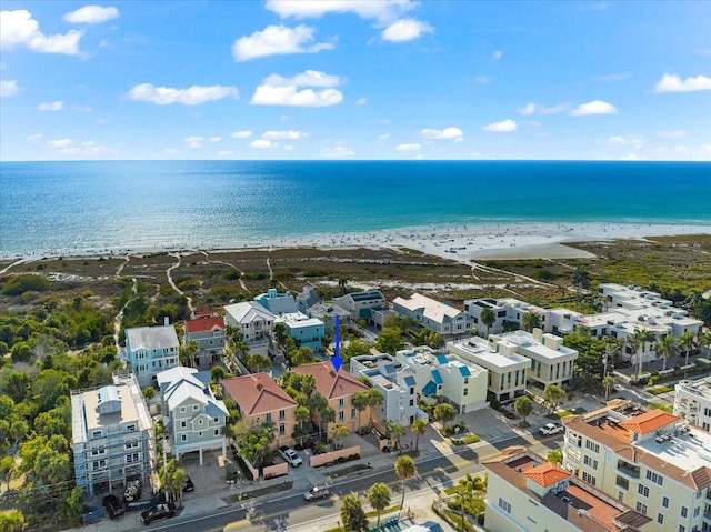 aerial view with a water view and a beach view