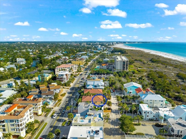 bird's eye view featuring a beach view and a water view