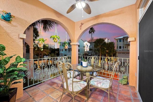 balcony at dusk with ceiling fan