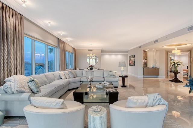 living room with ornamental molding and an inviting chandelier