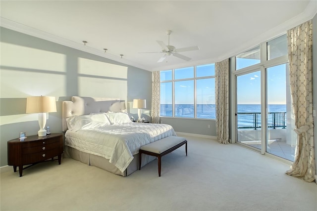 bedroom featuring crown molding, a water view, light colored carpet, and access to exterior