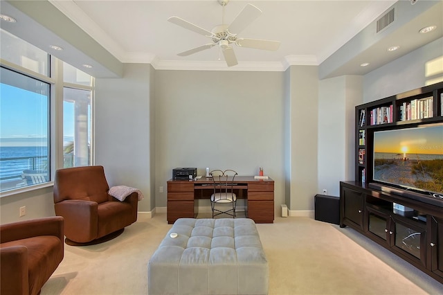 carpeted office with a water view, ceiling fan, and ornamental molding