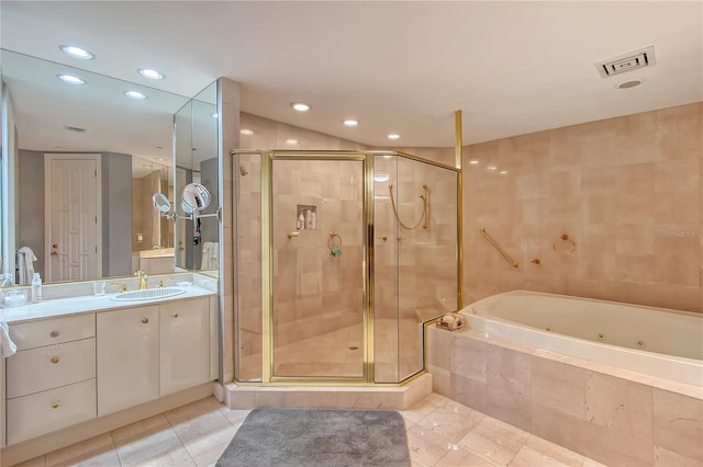 bathroom featuring vanity, shower with separate bathtub, and tile patterned flooring