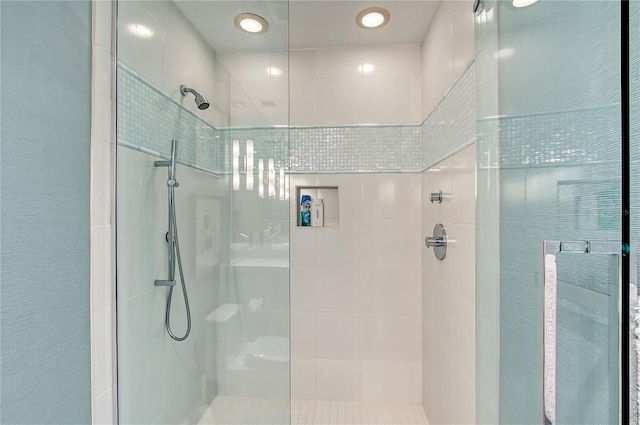 bathroom with a tile shower