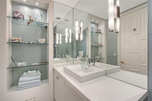 bathroom with vanity and an enclosed shower