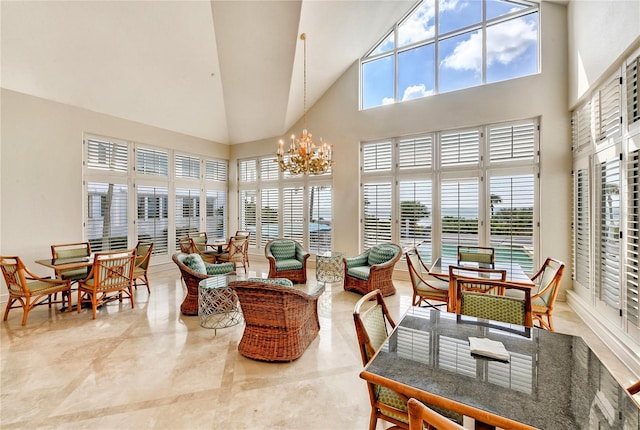 sunroom featuring an inviting chandelier