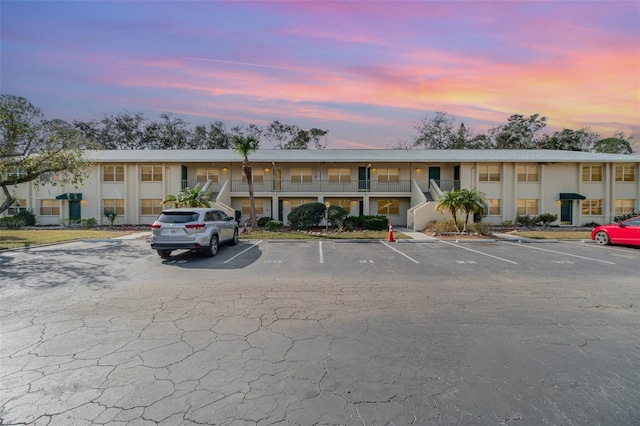 view of outdoor building at dusk