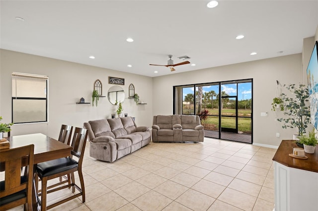 tiled living room with ceiling fan