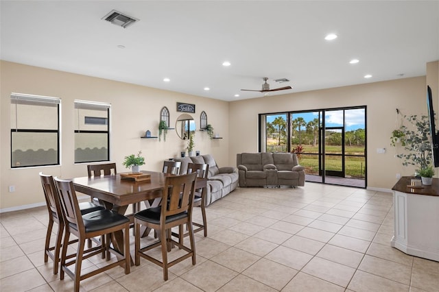 tiled dining room featuring ceiling fan