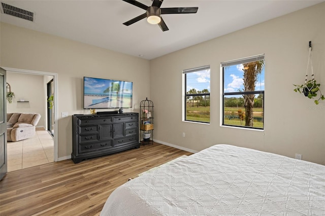 bedroom featuring wood-type flooring and ceiling fan