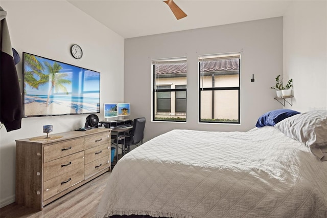 bedroom with light wood-type flooring and ceiling fan