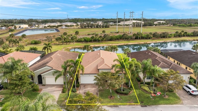 birds eye view of property featuring a water view