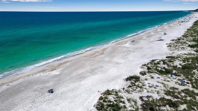 aerial view featuring a water view and a beach view