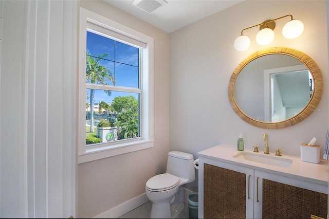 bathroom with vanity and toilet