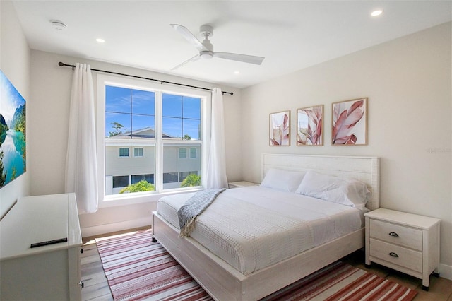 bedroom with hardwood / wood-style flooring and ceiling fan