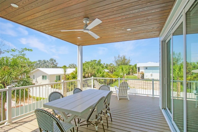 wooden deck featuring ceiling fan