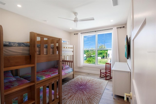 bedroom featuring wood-type flooring and ceiling fan