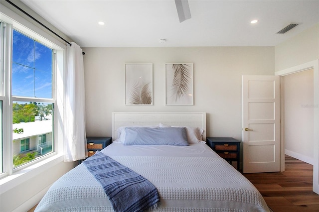 bedroom featuring dark hardwood / wood-style flooring and ceiling fan