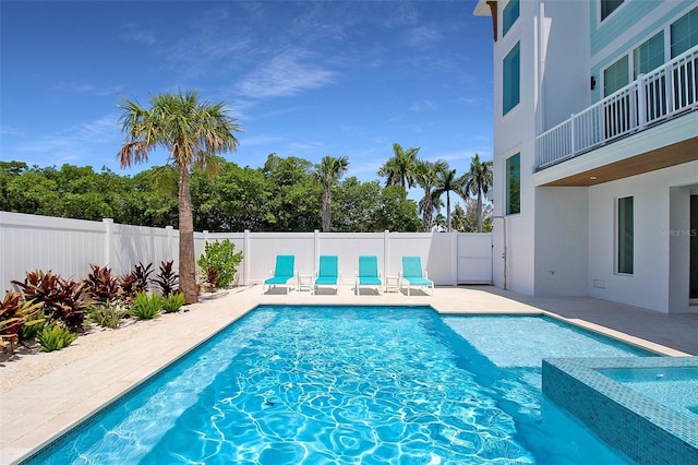 view of swimming pool with a patio