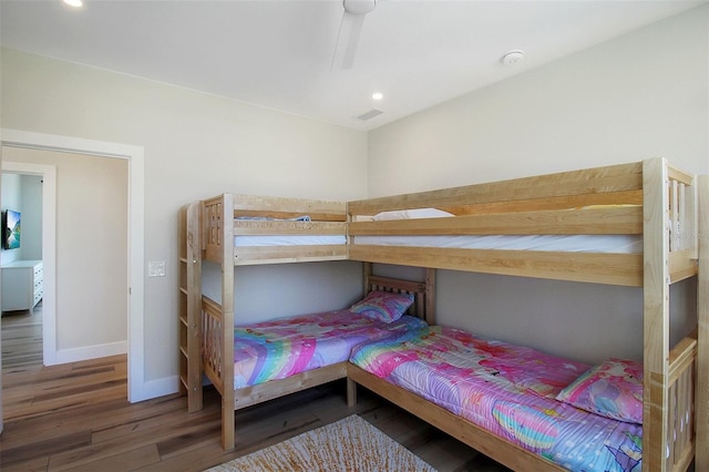 bedroom with dark hardwood / wood-style floors