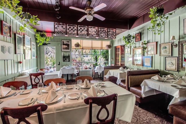 dining space with ceiling fan and wood ceiling