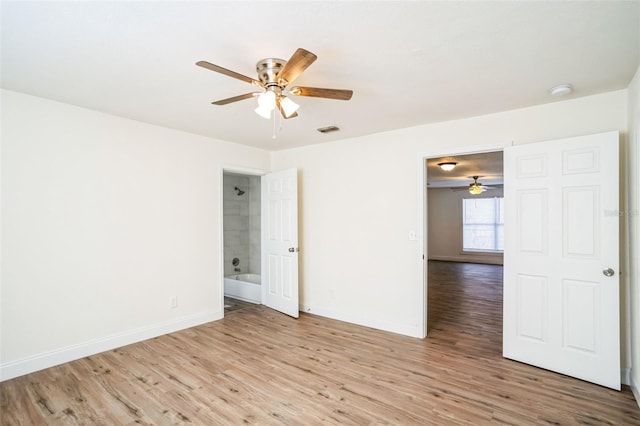 empty room with light hardwood / wood-style flooring