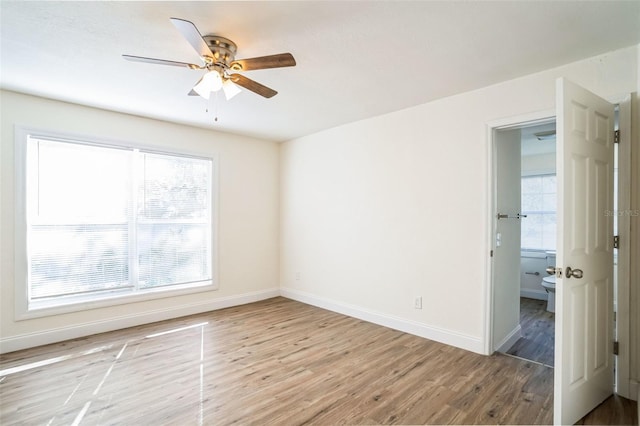 unfurnished room featuring ceiling fan and light hardwood / wood-style flooring