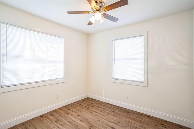 unfurnished room with ceiling fan and light hardwood / wood-style floors