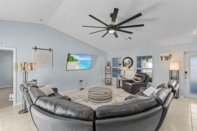 tiled living room with ceiling fan and vaulted ceiling