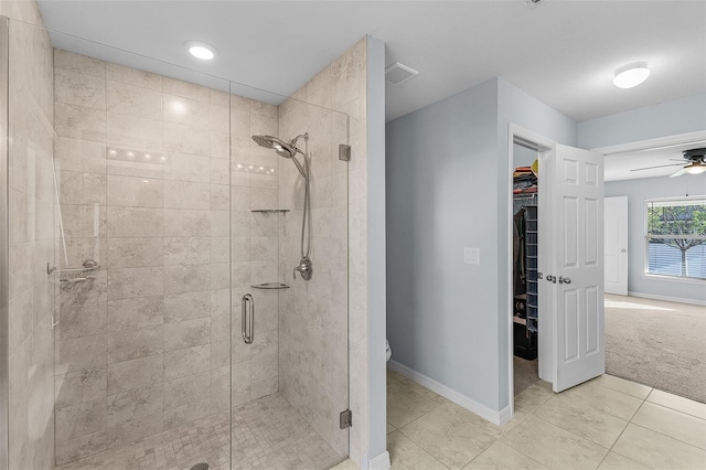 bathroom featuring toilet, walk in shower, tile patterned flooring, and ceiling fan