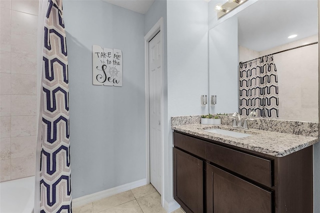 bathroom featuring a shower with curtain, tile patterned floors, and vanity