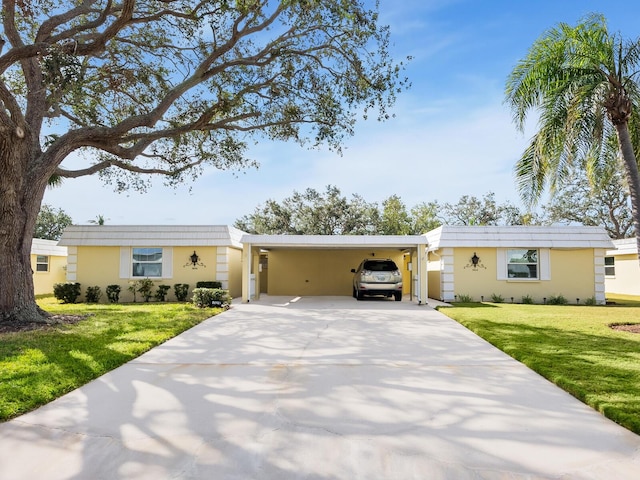 ranch-style home with a front lawn and a carport