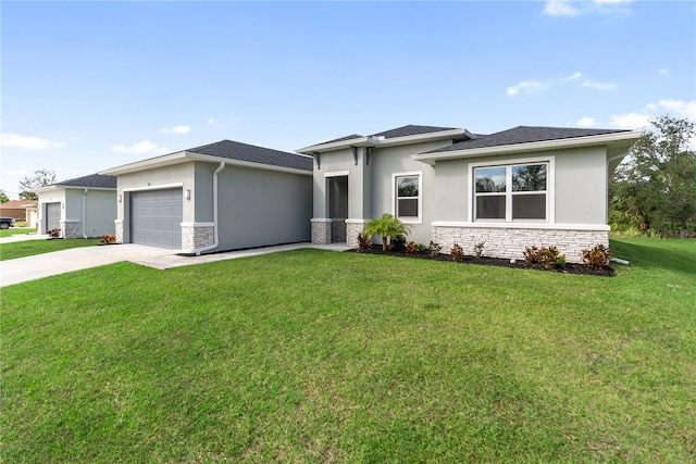 prairie-style home with a front lawn and a garage